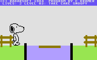 Snoopy (Commodore 64) screenshot: Crossing a water obstacle requires jumping on to a moving platform.