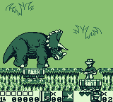 Jurassic Park Part 2: The Chaos Continues (Game Boy) screenshot: Zone 1's big boss, a full sized triceratops.
