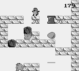 Doki Doki Penguin Land (Game Boy) screenshot: Dropping a boulder on the ice bear