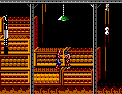 Spider-Man (SEGA Master System) screenshot: Beating up bad guys in a warehouse