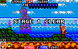 Toki (Lynx) screenshot: Toki does a little victory salute at the end of each level
