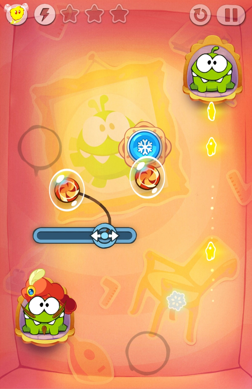 Cut the Rope: Time Travel (Android) screenshot: With time frozen, candies still move according to the laws of physics (in-game physics that is)