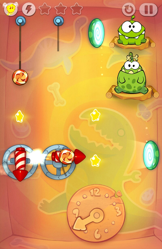 Cut the Rope: Time Travel (Android) screenshot: Rockets and portals and clocks in the prehistoric era