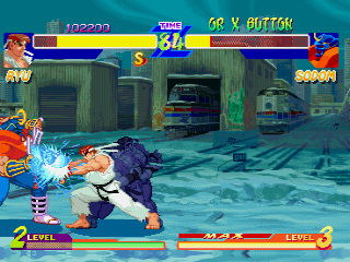 Street Fighter Alpha: Warriors' Dreams (PlayStation) screenshot: Sodom blocks against the Ryu's Shinkuu Hado Ken.