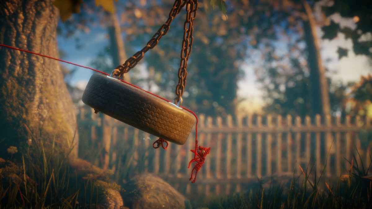 Unravel (Windows) screenshot: Swinging from an old tire