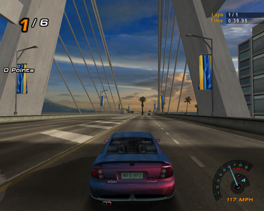 Need for Speed: Hot Pursuit 2 (Windows) screenshot: The second motif is a Hawaiian one. Including volcanos and villages with huts. It also looks like Pride Parade is happening sometime soon.