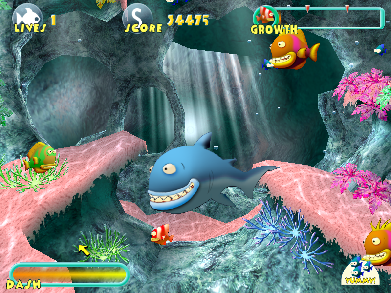 Fish Tales (Windows) screenshot: Sharks will often swim by and eat everything in their way.