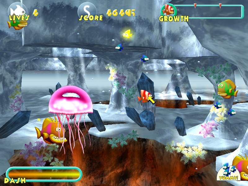 Fish Tales (Windows) screenshot: That hunter medusa (large jellyfish) can paralyze you for a short time, but is harmless otherwise. Eat enough of those yellow fish and you will get an extra life.