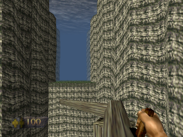 Turok: Dinosaur Hunter (Nintendo 64) screenshot: Making your way across a narrow log bridge