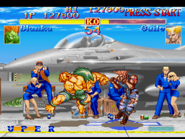 Street Fighter Collection (PlayStation) screenshot: Aiming a counterattack, Blanka uses his move Surprise Forward and approaches a more little of Guile.