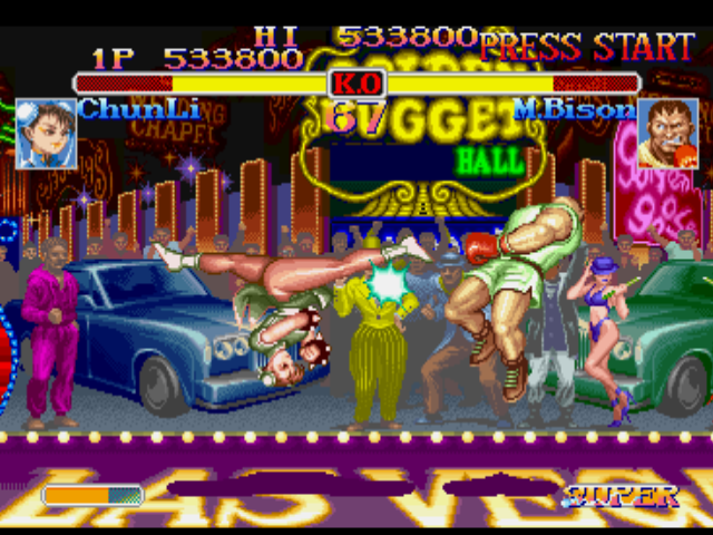 Street Fighter Collection (PlayStation) screenshot: Chun-Li uses her Spinning Bird Kick move and stops temporarily M. Bison's (Balrog's) offensives...