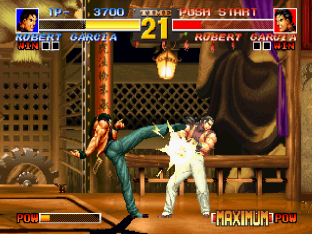The King of Fighters '95 (PlayStation) screenshot: P1 Robert hit-damaging P2 Robert with some hits of his close-kickin' move Kyokugen-ryuu Renbu Kyaku.