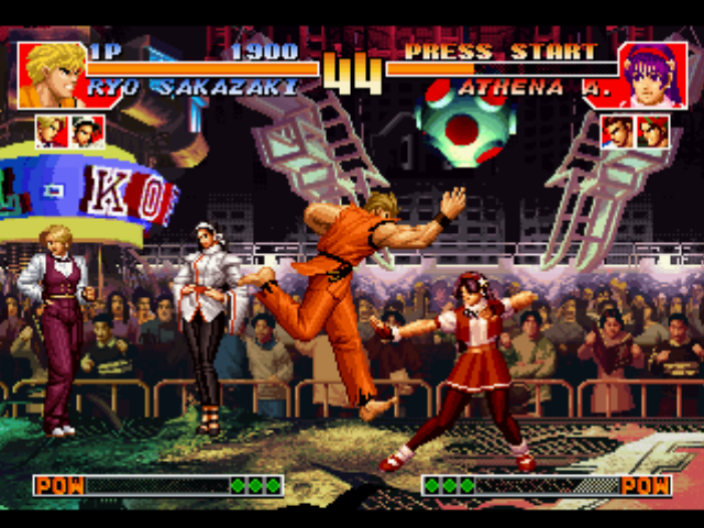 The King of Fighters '97 (PlayStation) screenshot: Meanwhile, Athena Asamiya is about to be struck-damaged by Ryo Sakazaki's move Mouko Raijin Setsu...