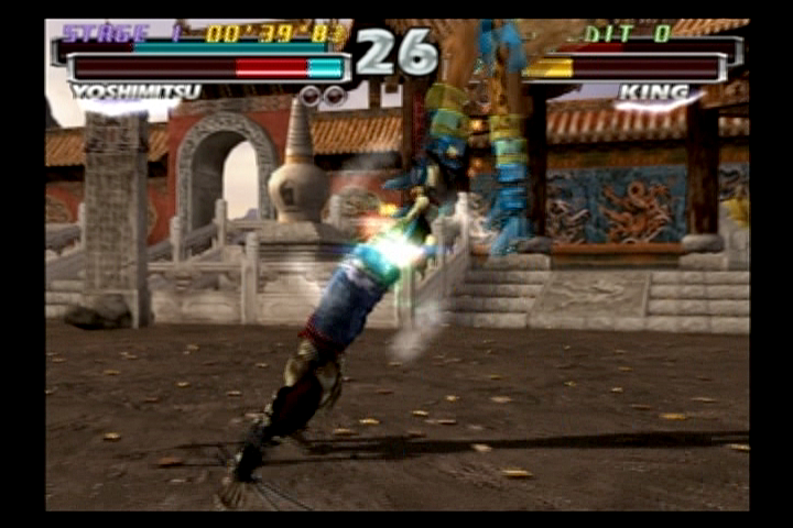 Tekken Tag Tournament (PlayStation 2) screenshot: Yoshimitsu giving King a pretty wicked kick.
