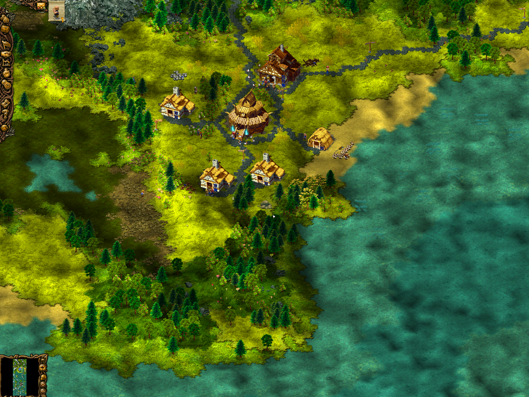 Cultures 2: The Gates of Asgard (Windows) screenshot: Zoomed out view of the village and sea.