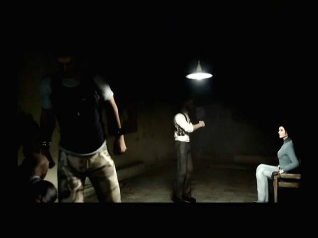 Tom Clancy's Splinter Cell: Double Agent (PlayStation 2) screenshot: An interrogation of some sort.