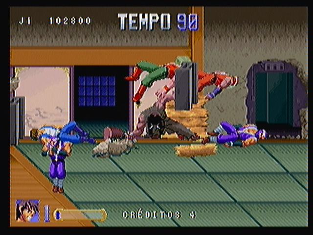 Double Dragon (Zeebo) screenshot: See that broken wall there? The guy pounding the ground with that club and making the ceiling collapse (stage four boss) did it.