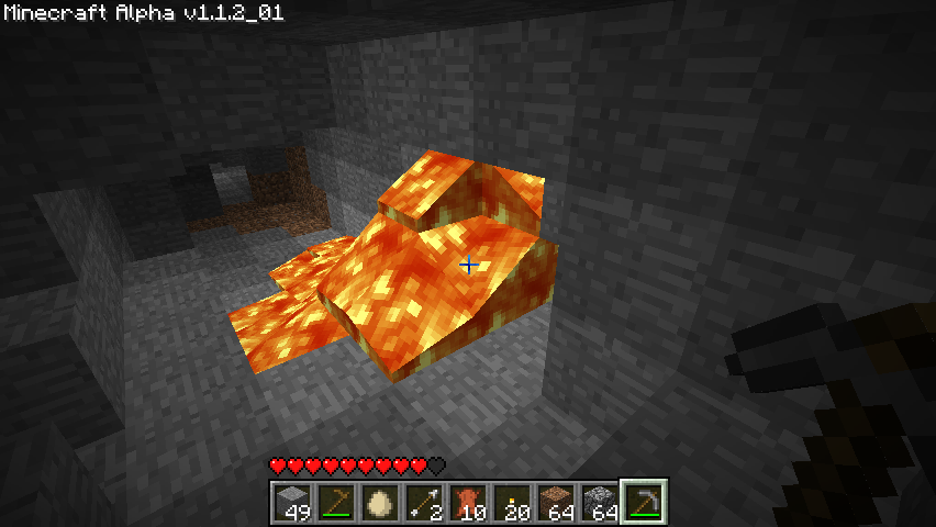 Minecraft (Windows) screenshot: Lava flow in a cave.