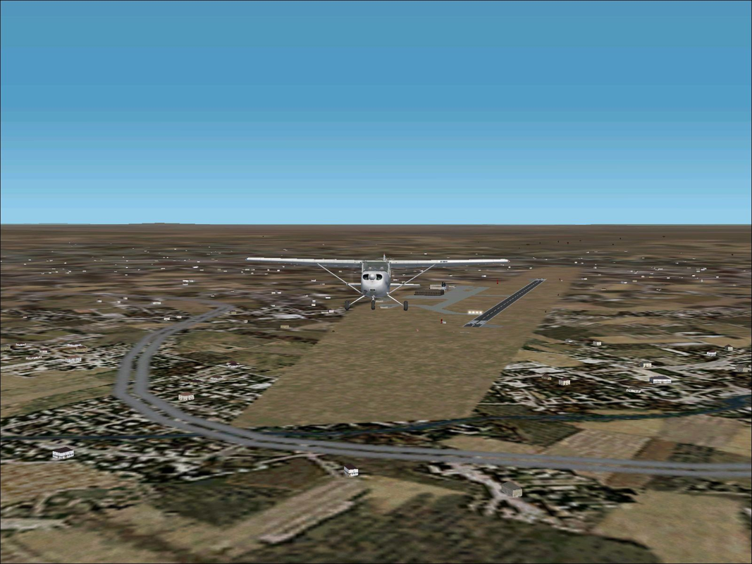 VFR Photographic Scenery: Central & Southern England (Windows) screenshot: Southampton International Airport. Shortly after take-off with the additional scenery disabled