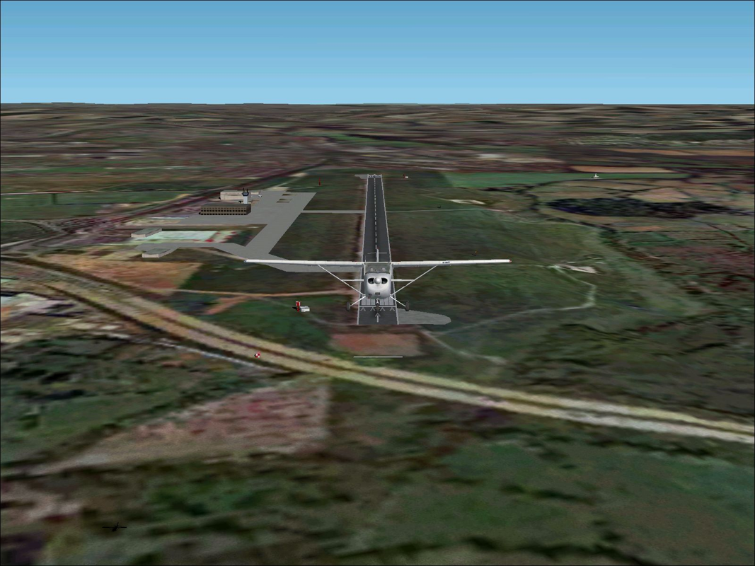 VFR Photographic Scenery: Central & Southern England (Windows) screenshot: Southampton International Airport. Shortly after take-off with the additional scenery enabled.