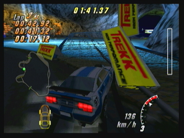 Raging Thunder II (Zeebo) screenshot: Racing with a blue Tango R car in time attack mode. Some circuits have shortcuts hidden by obstacles that can be ran over.