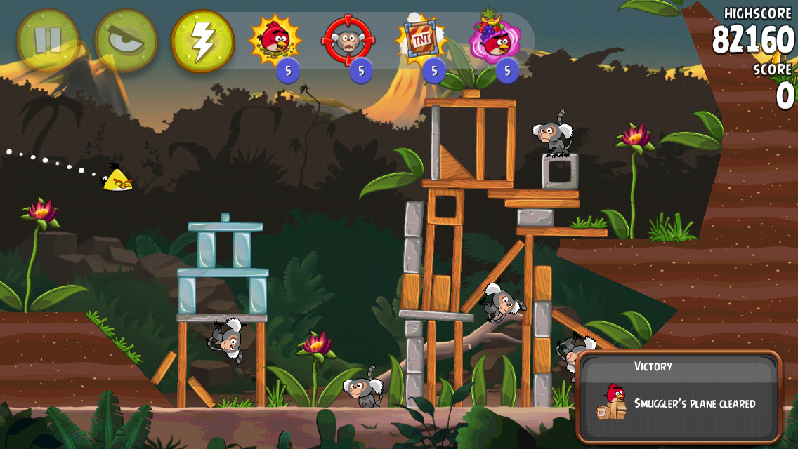 Angry Birds: Rio (iPhone) screenshot: A yellow bird in flight