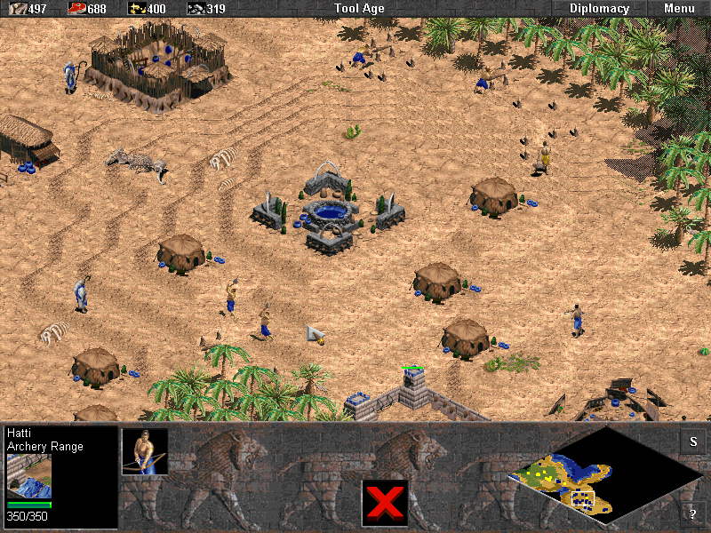 Age of Empires (Demo Version) (Windows) screenshot: A Tool Age settlement.