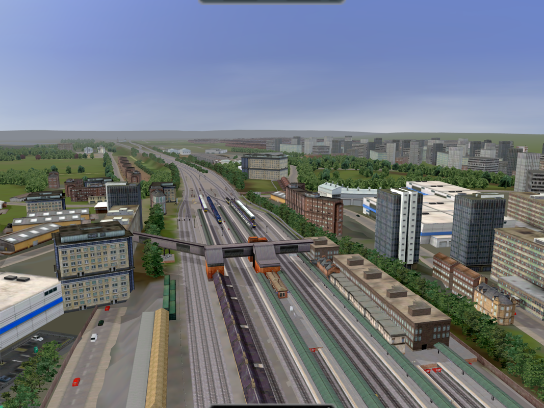 Rail Simulator (Windows) screenshot: Quite a lot of city far off the tracks. Looks good, not much load on the graphics card either.