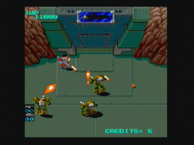 Heavy Barrel (Zeebo) screenshot: These three jumping mechs are the sixth boss.