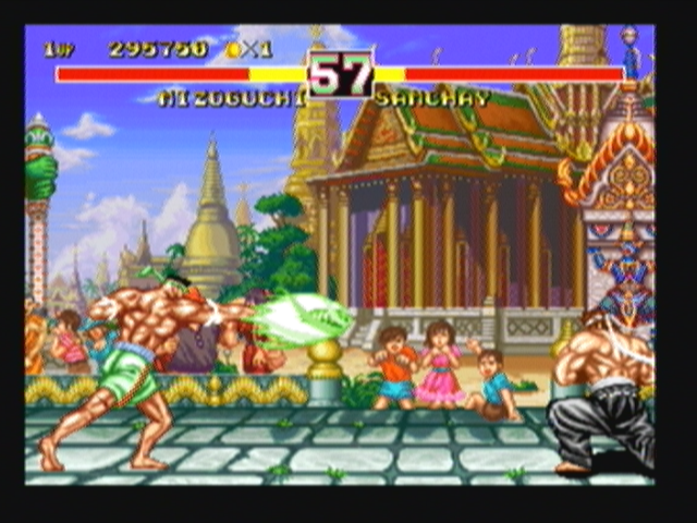Fighter's History Dynamite (Zeebo) screenshot: Samchay throws a Mattron Dusalop.