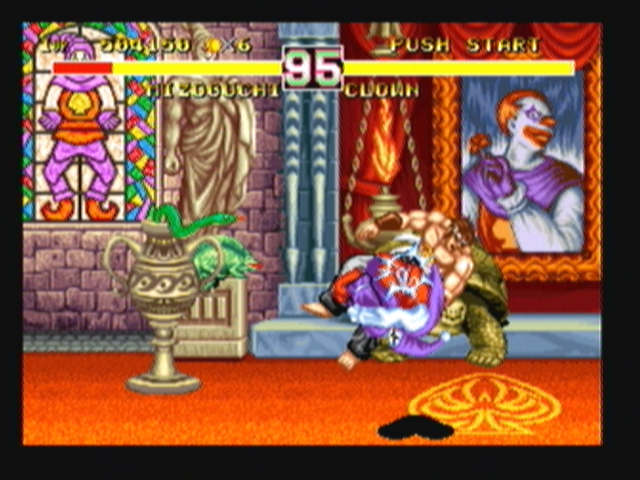 Fighter's History Dynamite (Zeebo) screenshot: Clown uses a Spin Attack.