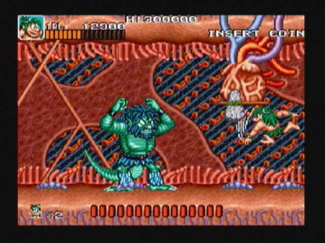 Joe & Mac: Caveman Ninja (Zeebo) screenshot: After beating the huge dinosaur, the player enters its belly to find yet another boss.