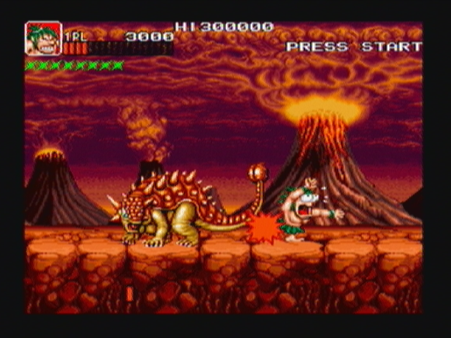 Joe & Mac: Caveman Ninja (Zeebo) screenshot: The stage 4 boss is an euoplocephalus.