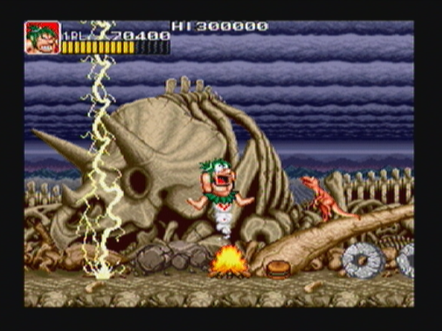Joe & Mac: Caveman Ninja (Zeebo) screenshot: Stage 5 seems to be a dinosaur burial ground.