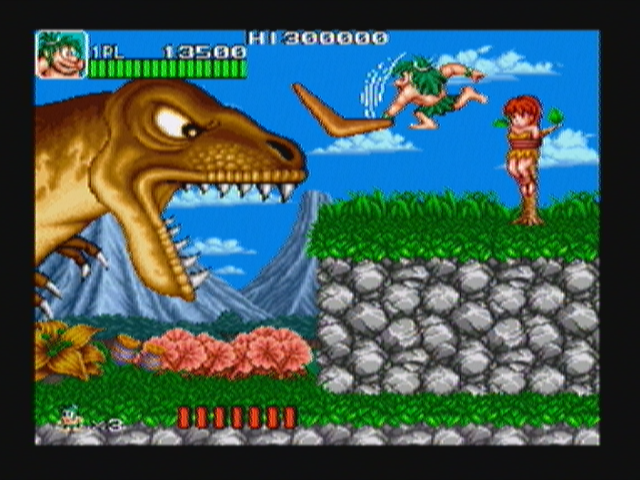 Joe & Mac: Caveman Ninja (Zeebo) screenshot: The first boss. If the player holds the attack button, the attack is charged and, when released, the weapon is a lot bigger and does more damage.