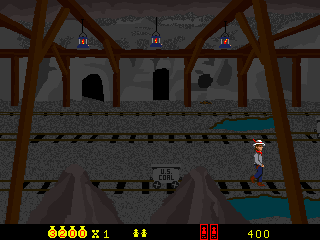 Cheyenne (Arcade) screenshot: Casually walking around a coal mine, watch out for mine carts