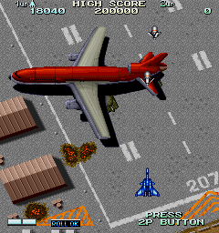 Vapor Trail (Arcade) screenshot: Flying over an airfield.