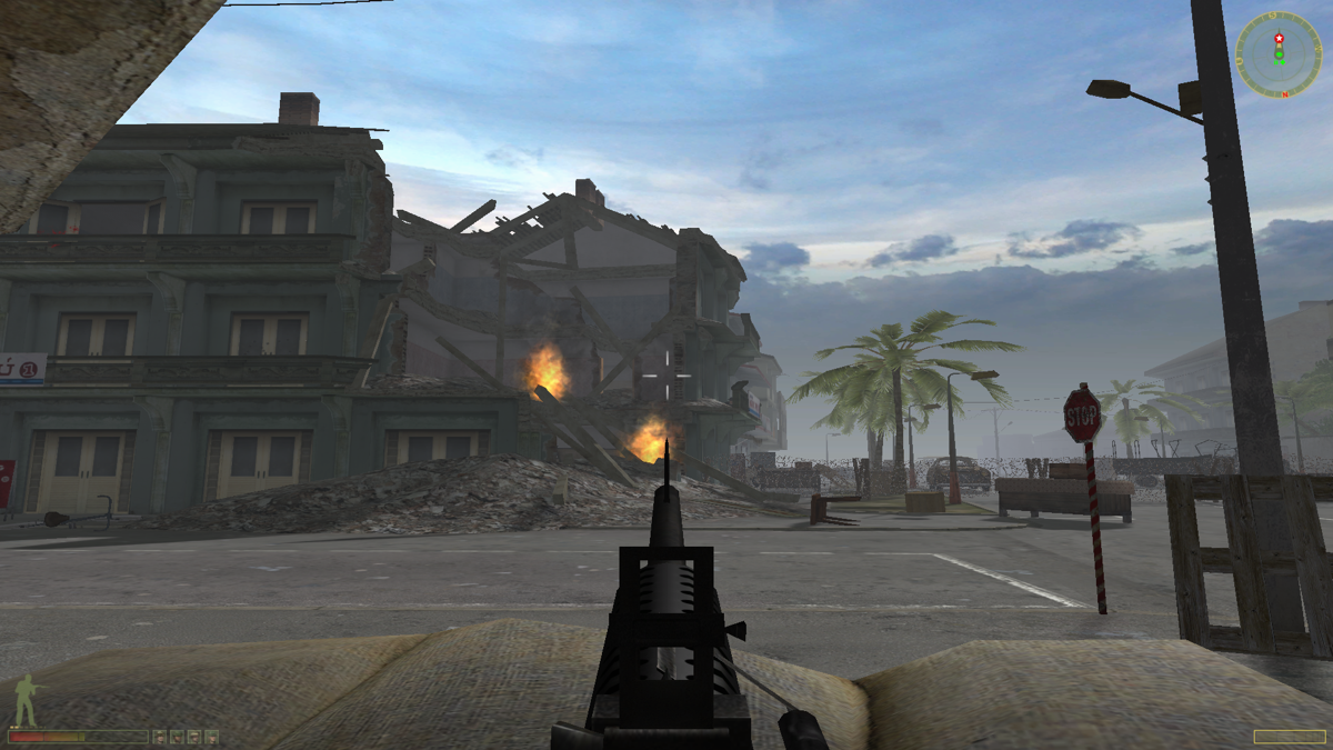 Vietcong 2 (Windows) screenshot: A tank just blew a hole in that building