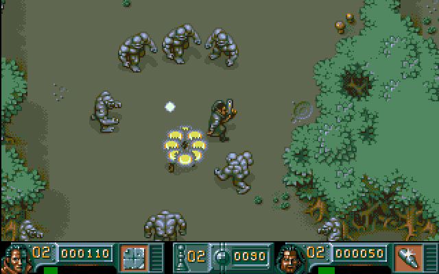 Soldiers of Fortune (Amiga) screenshot: Scrolling through the forest, you see a few rock monsters ganging up on you