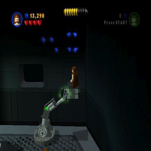 LEGO Star Wars: The Video Game (PlayStation 2) screenshot: Here 'The Force' has been used to repair a machine, now it is being used to power the machine so that the blue credits can be harvested. There are lots of little in-game puzzles like this