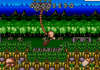 Chuck Rock II: Son of Chuck (Genesis) screenshot: Swing on the vines