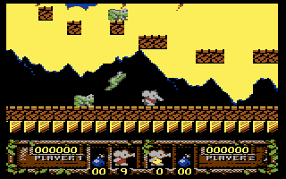 CJ's Elephant Antics (Commodore 64) screenshot: Watch out for leaping frogs!
