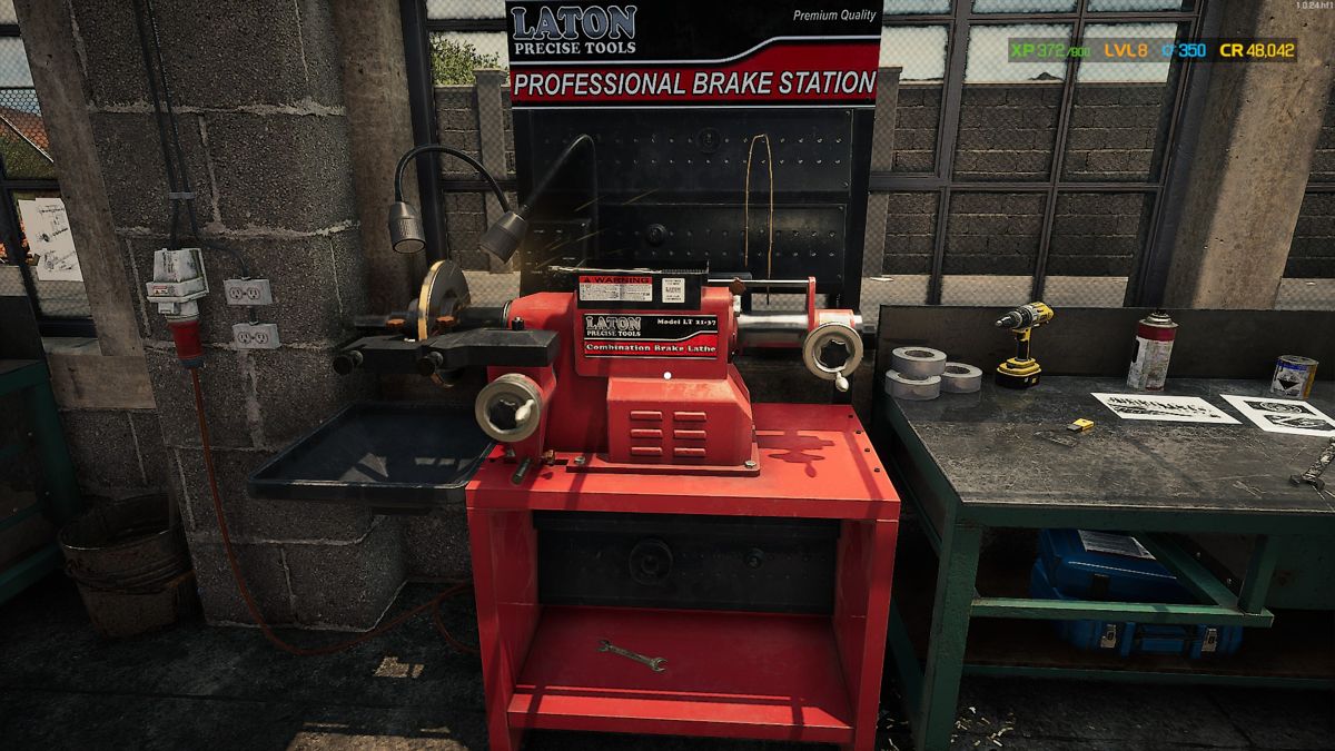 Car Mechanic Simulator 2021 (Windows) screenshot: Brake lathe and repair station.