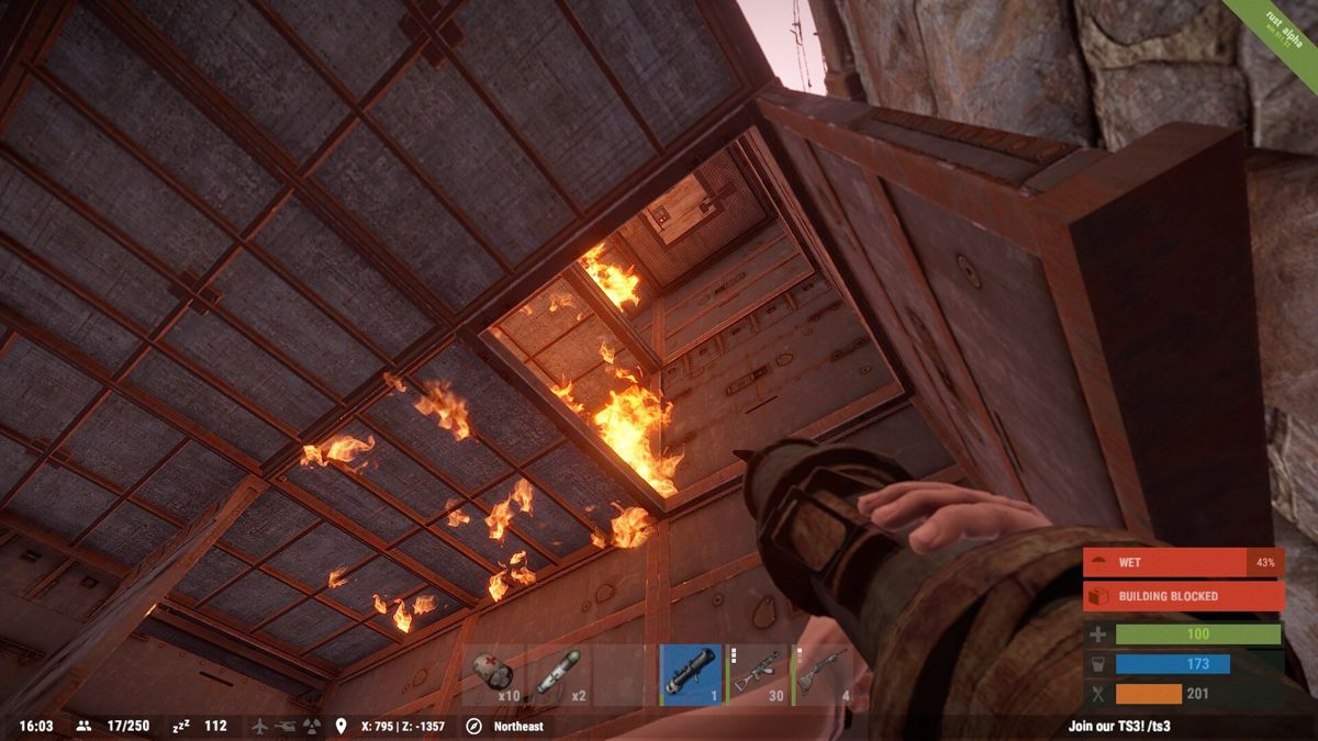 Rust (Windows) screenshot: Popping vertical hatches with a rocket launcher. Effective and cheap if you've got a large group. (alpha version win.911.51)