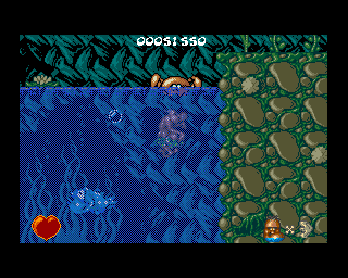 Chuck Rock (Amiga) screenshot: Level 3 - Chuck has to struggle through some underwater caverns. He can drown if he stays under water too long.