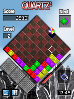 Quartz 2 (Symbian) screenshot: The player chooses where to put a "wildcard" block that can be grouped with blocks of any color