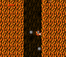 Disney's TaleSpin (NES) screenshot: Through a cave filled with bombs