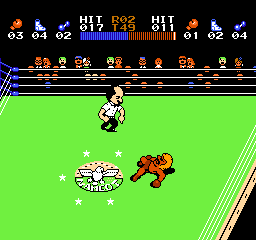 Ring King (NES) screenshot: He' down. The referee is counting down.