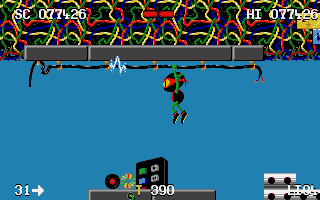 Zool (DOS) screenshot: Zool clings to a cable to avoid ground enemies - but he better beware the spark!