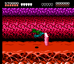 Battletoads (NES) screenshot: Much of the Turbo Tunnel consists of racing through on a turbo bike and dodging obstacles